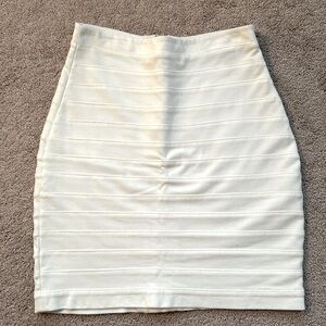 Cream colored skirt.
